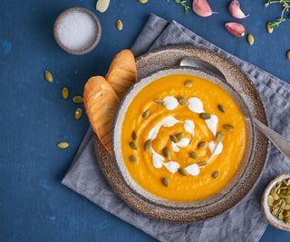 Pumpkin seeds on bowl of pumpkin soup