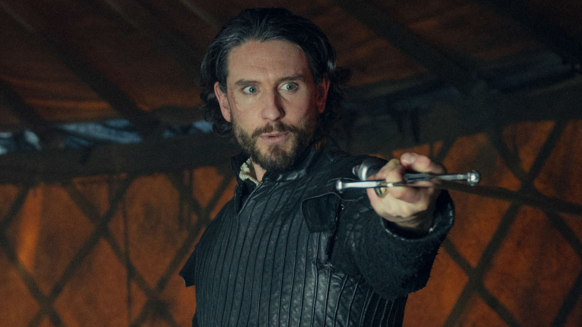 The White Flame points a sword to something offscreen