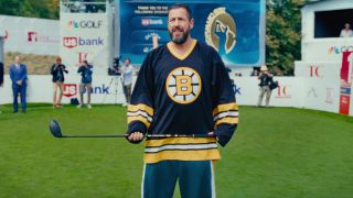 Adam Sandler in Happy Gilmore 5 holding a golf club with both hands. 
