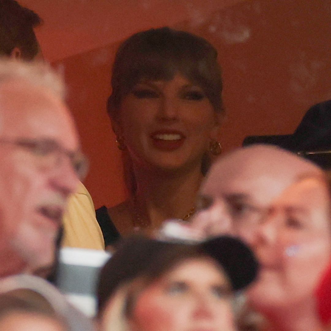 Taylor Swift in the stands at the Chiefs game wearing a custom jersey and Louis Vuitton earrings