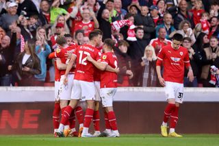 Barnsley season preview 2023/24 Liam Kitching of Barnsley celebrates with teammates after scoring the team's first goal during the Sky Bet League One Play-Off Semi-Final Second Leg match between Barnsley and Bolton Wanderers at Oakwell Stadium on May 19, 2023 in Barnsley, England.