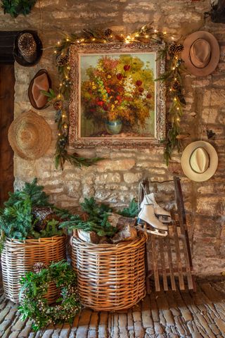 stone passageway in country home with old ice skates, baskets and Christmas decorations