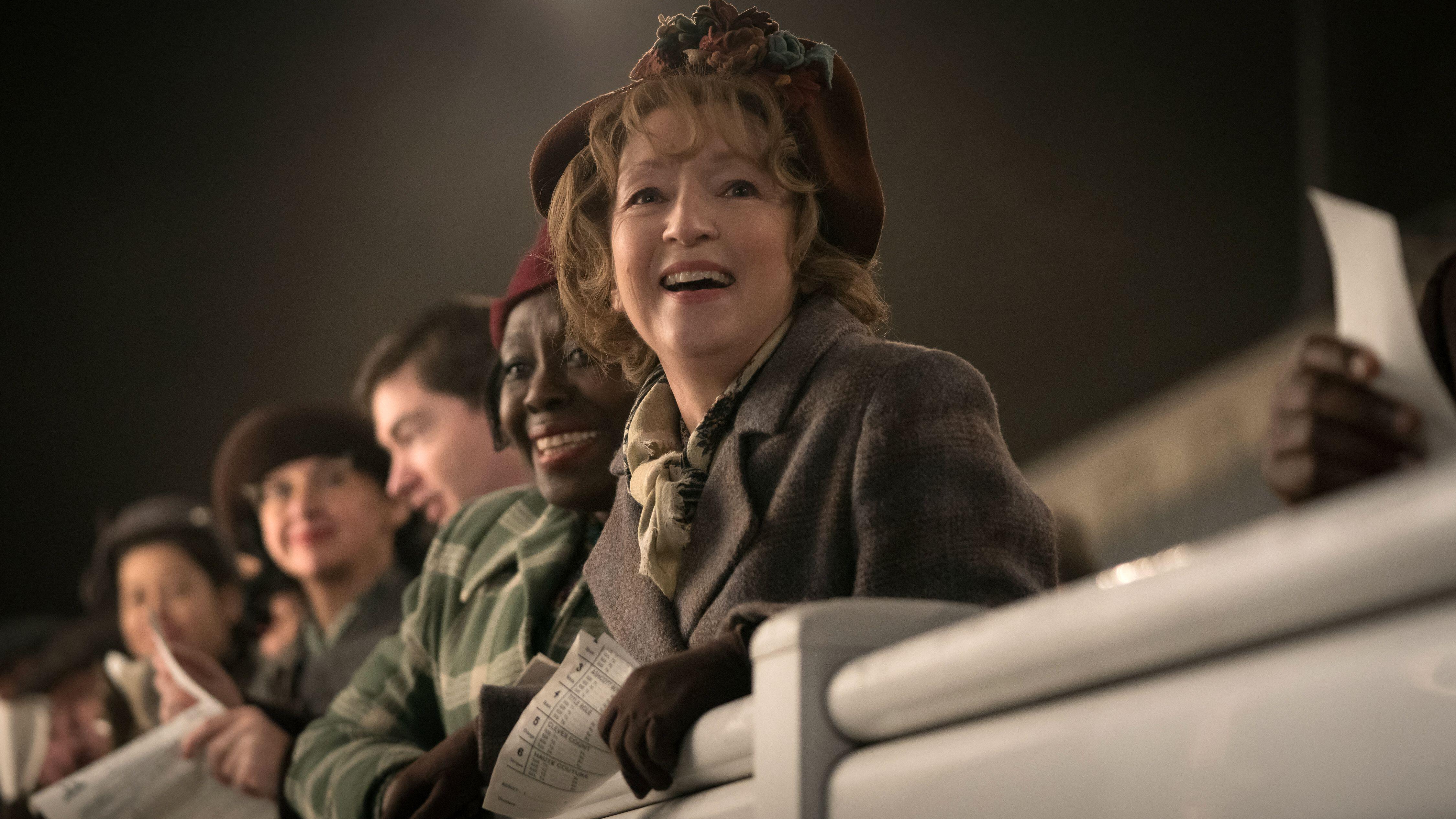 Mrs. Harris (Lesley Manville) at the racetrack in a still from "Mrs. Harris Goes To Paris"