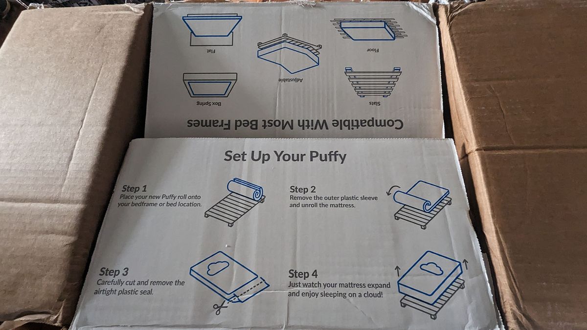 Close up of top of Puffy Lux Hybrid mattress box, with opening instructions