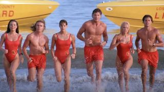 The Baywatch cast running towards the camera.