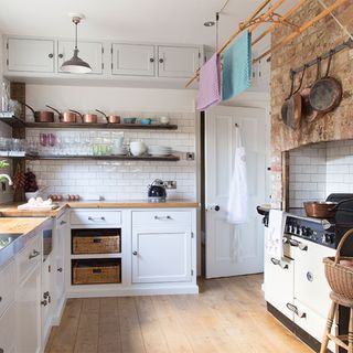 shabby chic kitchen with exposed brickwork and range cooker