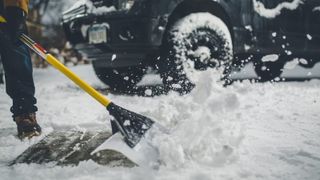 The Snowplow 36-inch Snow Pusher in use