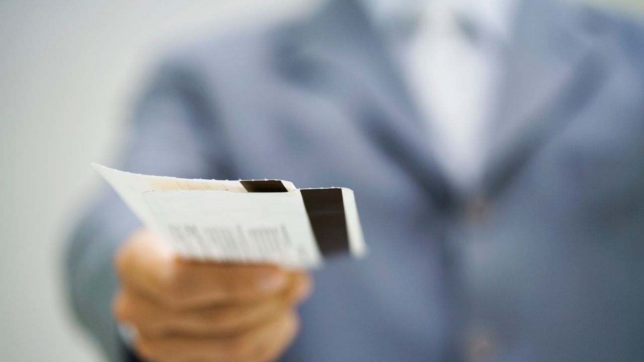 Person holding train tickets