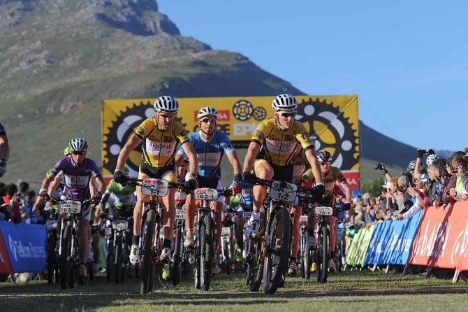 Overall race leaders, Christoph Sauser and Jaroslav Kulhavy of Team Burry Stander - Songo lead the bunch at the start