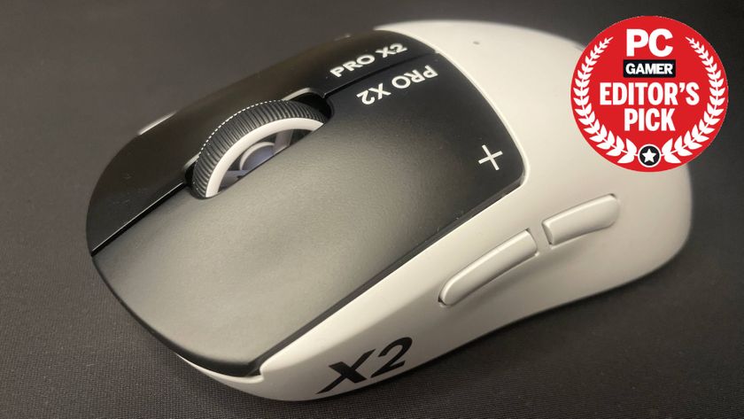 A Logitech G Pro X2 Superstrike gaming mouse on a mouse pad with a PC Gamer Editor's Pick label overlayed.