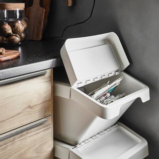 kitchen area with white waste sorting bin