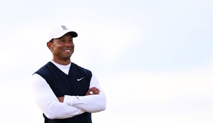 Woods stands and stares down the fairway