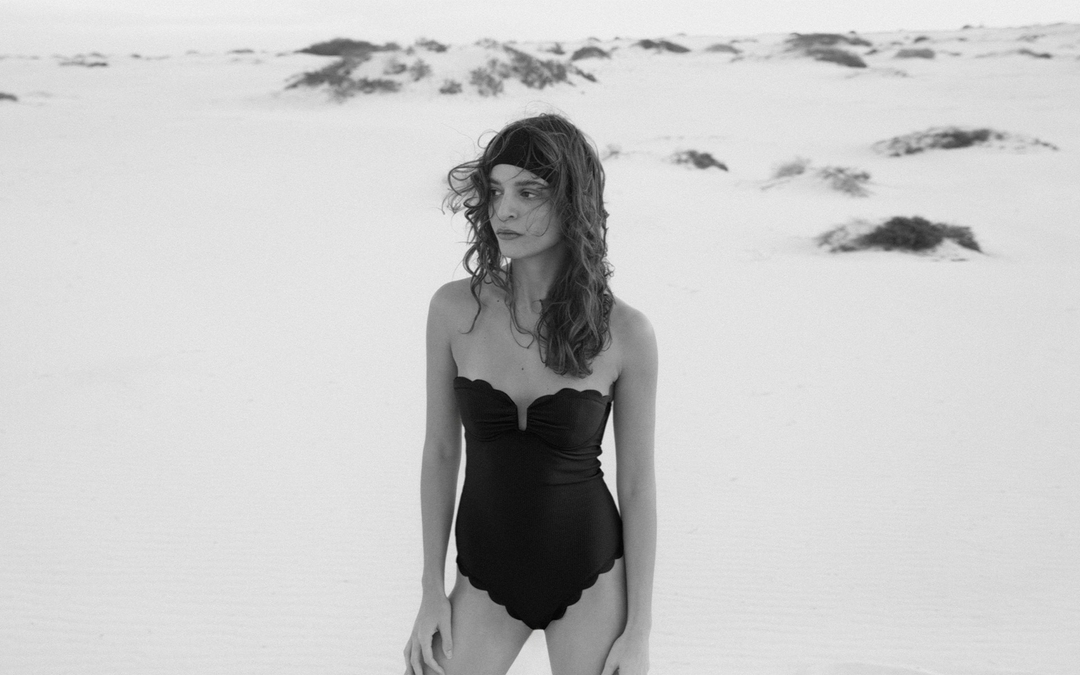 Marysia wearing a scallop-edge swimsuit.