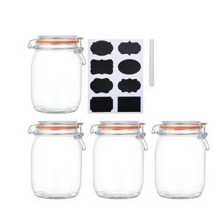 Four glass jars with chalk labels