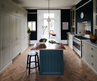 grey kitchen with island and wood floors