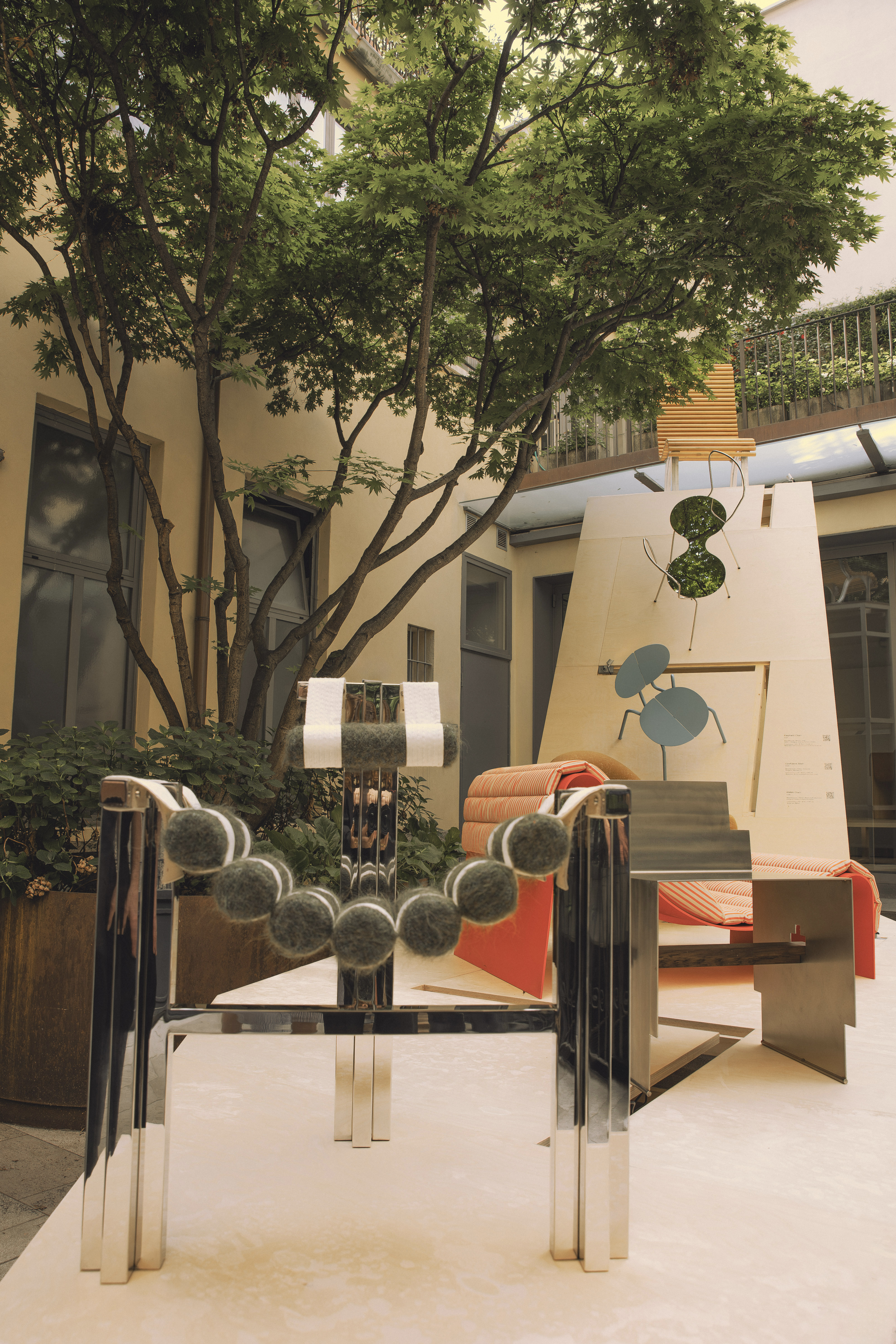 furniture and lighting displayed on timber platform