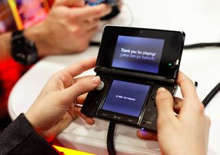 Someone playing a Nintendo 3DS