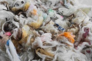 Close up image of colourful thick wool yarns in a bundle
