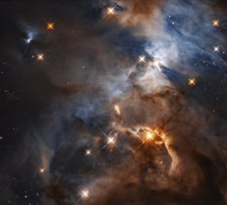 The striking "bat shadow" cast by the young star HBC 672 can be seen in this Hubble telescope view of part of the Serpens Nebula.