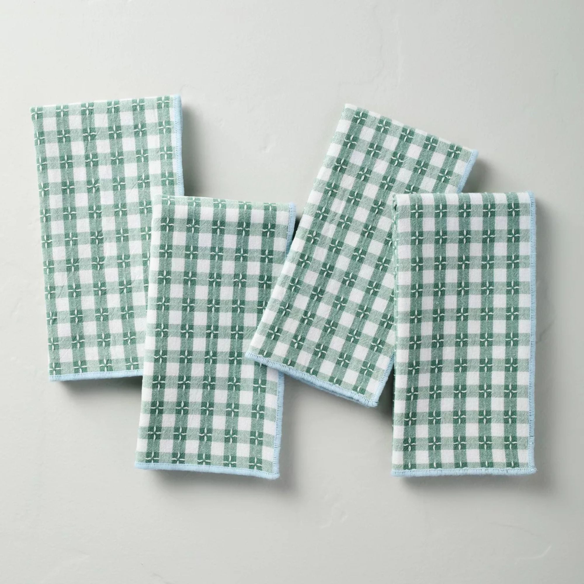 Reversible napkins in green and blue gingham and stripes