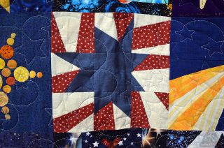 Karen Nyberg's sewn-in-space star square premiered on display at the International Quilt Festival in Houston.