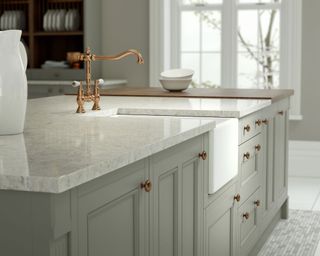 Neutral kitchen island detail with ceramic sink