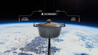 The Le Creuset Star Trek Casserole Dish flying above the Earth.