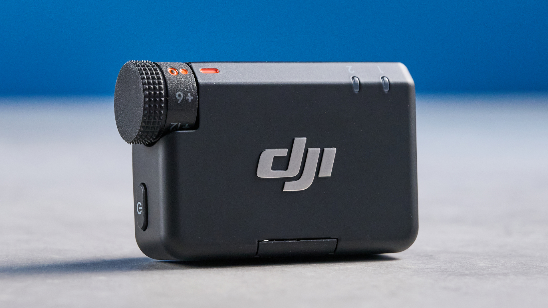 the dji mic mini 2 for camera and smartphone conent creators photographed against the blue tom's guide background
