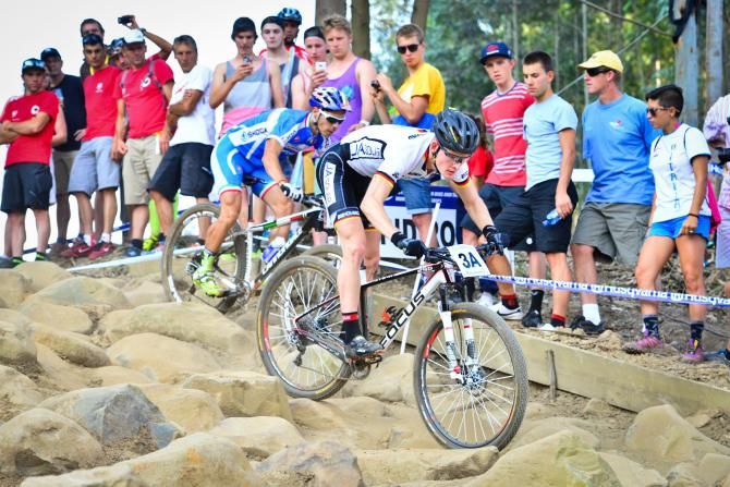 http://www.gameplanmedia.co.za/mtb/2013E3RapidRocksGER100.jpg Markus Schulte-Luenzum of Germany leads Marco Fontana leads into Rapid Rocks on the first lap of the Cross Country Team Relay