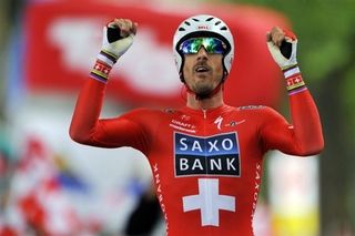 Fabian Cancellara celebrates after taking the final TT and the overall Tour de Suisse.