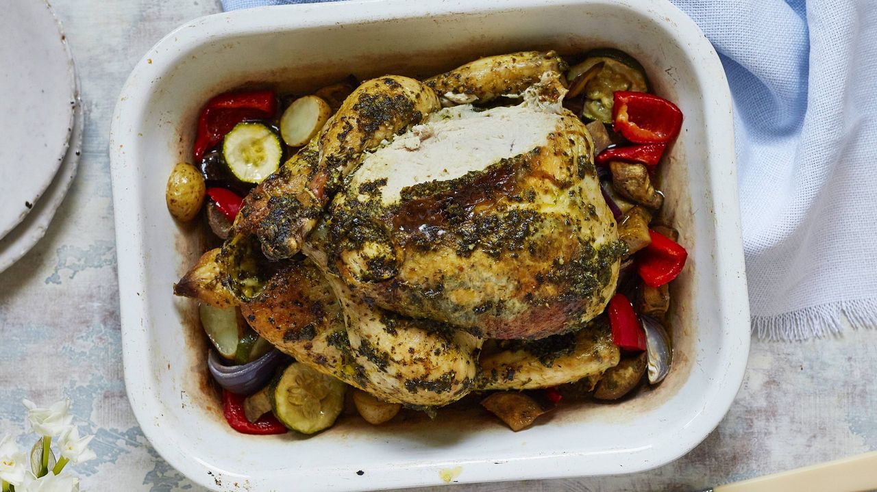 Spinach and rocket pesto roast chicken with roasted veg to serve