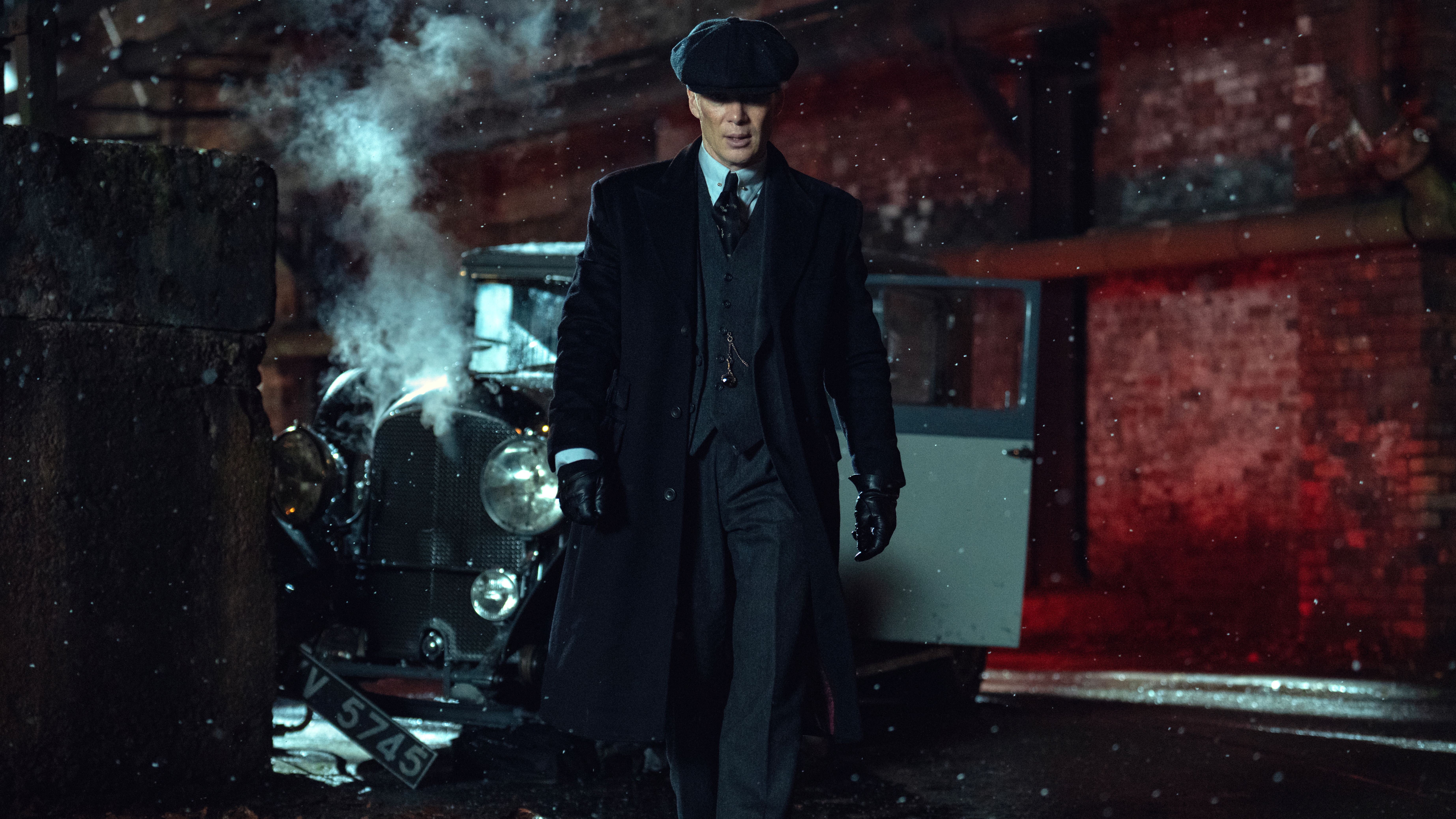 Tommy Shelby (Cillian Murphy) walks away from a crashed car in a scene from "Peaky Blinders: The Immortal Man"