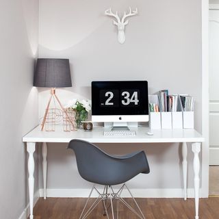 room with desk table and lamp
