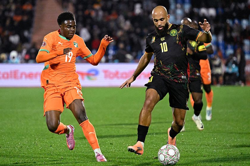 Cameroon's midfielder #10 Bryan Mbeumo (R) fights for the ball with Ivory Coast's midfielder #19 Christ Inao Oulai (L) during the Africa Cup of Nations (CAN) Group F football match between Ivory Coast and Cameroon at Marrakesh Stadium in Marrakesh on December 28, 2025. (Photo by Khaled DESOUKI / AFP)