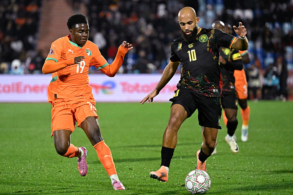 Cameroon's midfielder #10 Bryan Mbeumo (R) fights for the ball with Ivory Coast's midfielder #19 Christ Inao Oulai (L) during the Africa Cup of Nations (CAN) Group F football match between Ivory Coast and Cameroon at Marrakesh Stadium in Marrakesh on December 28, 2025. (Photo by Khaled DESOUKI / AFP)