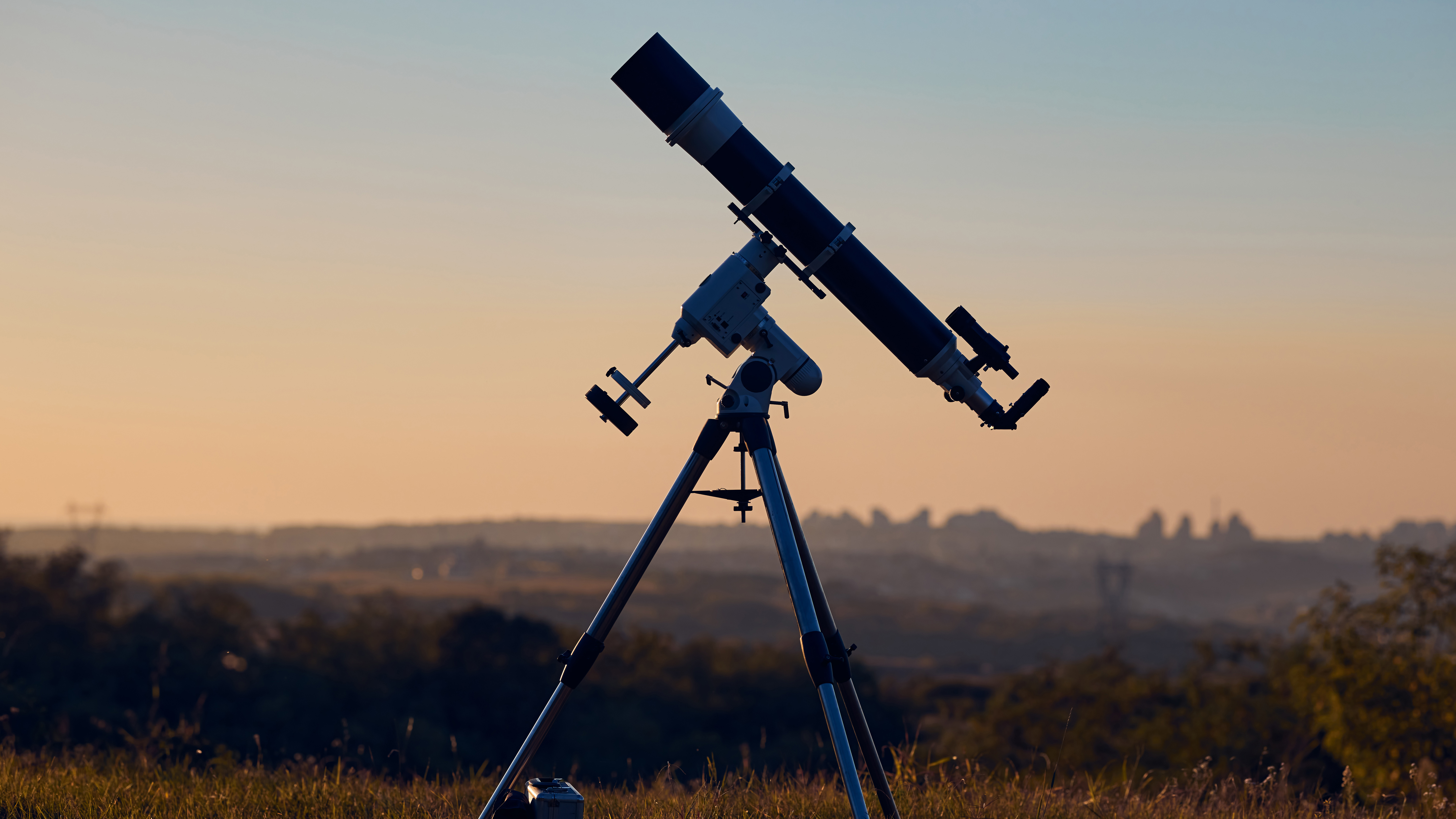 Telescopes at Best Buy: Image shows telescope against countryside backdrop
