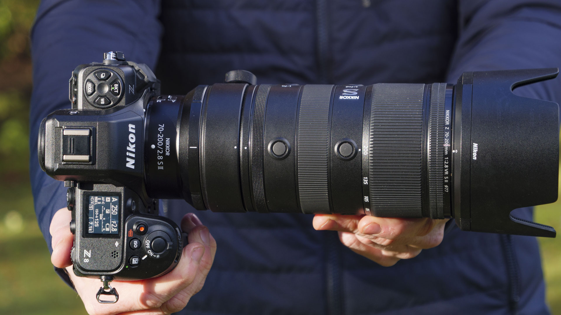 Man holding the Nikon Z8 camera with the Nikon Z 70-200mm f/2.8 VR S II lens attached