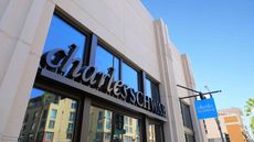Large Charles Schwab signage on the side of a building