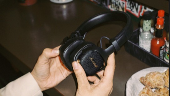 Marshall Milton ANC wireless headphones in black held in the hand