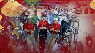 The Expedition 66 crew of the International Space Station sent a video message to Earth for Christmas 2021. From left to right: NASA astronauts Mark Vande Hei, Raja Chari and Kayla Barron, ESA astronaut Matthias Maurer and NASA astronaut Thomas Marshburn.