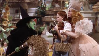 The Witch and Dorothy in The Wizard of Oz while she holds Toto.