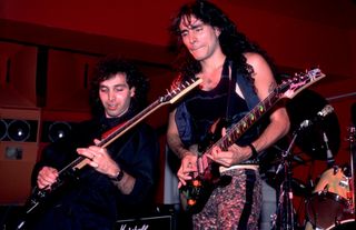 Joe Satriani (left) and Steve Vai perform onstage at the Limelight in Chicago, Illinois on June 27, 1987
