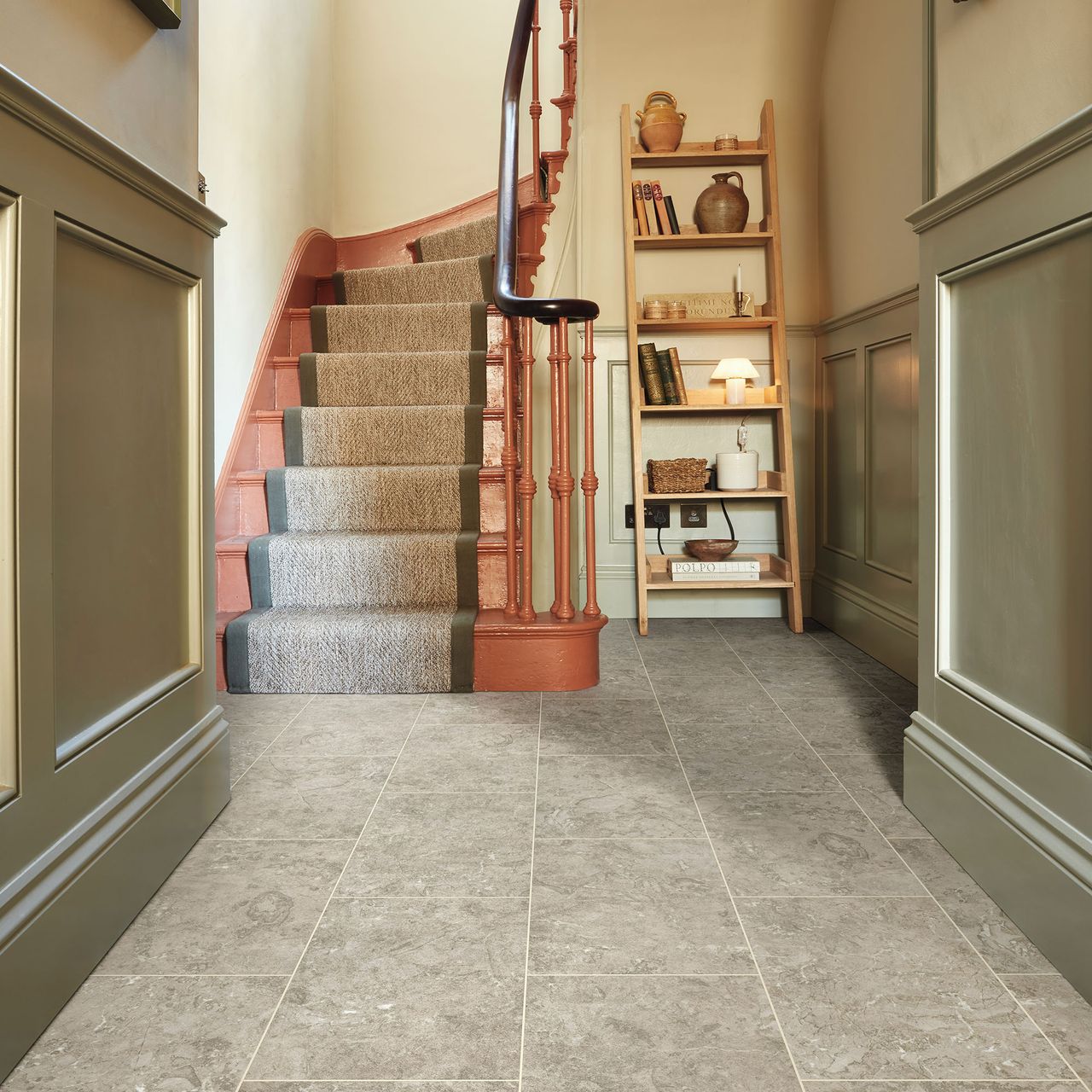 Hallway with stone effect LVT flooring and sage green panelled walls