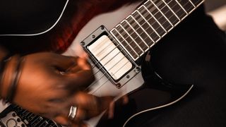 Diamond Rowe poses with her Jackson Pro Series Signature Monarkh DR12MG