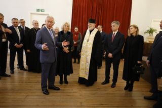 Prince Charles, Prince of Wales and Camilla, Duchess of Cornwall stand next to Bishop Kenneth Nowakowski and Ukrainian ambassador to Britain Vadym Prystaiko (2nd R) and his wife Inna Prystaiko (R) as they meet people from the community