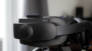 A closeup of the HTC Vive Focus 3's quick-release headband and battery indicator