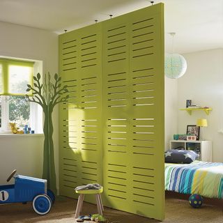 kids bedroom with lime green dividing wall