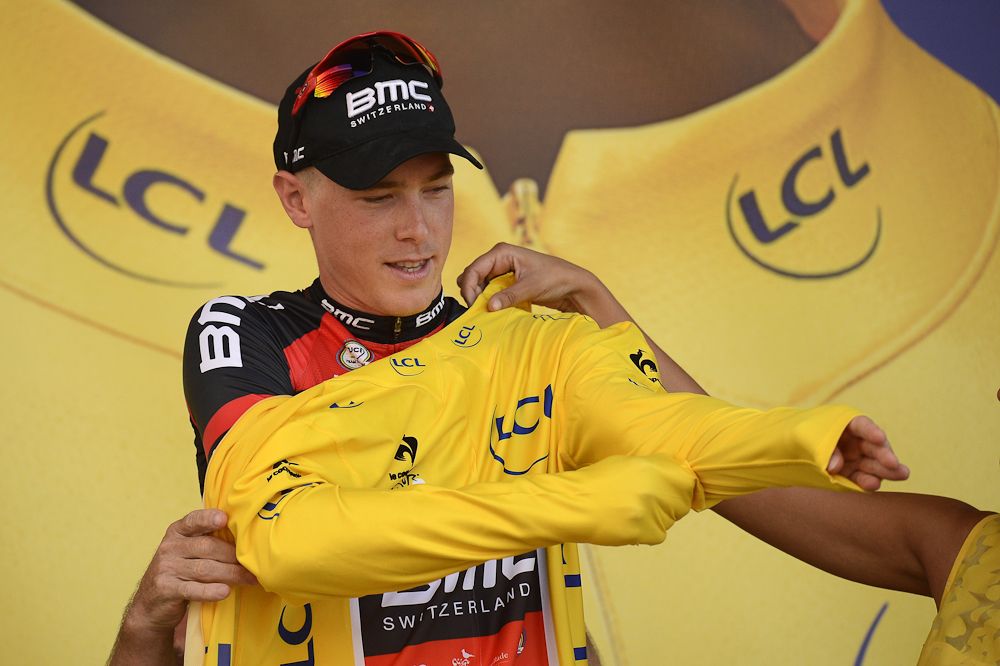 Rohan Dennis pulls on the first yellow jersey of the 2015 Tour de France.