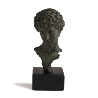 bust sculpture of a young boy in bronze