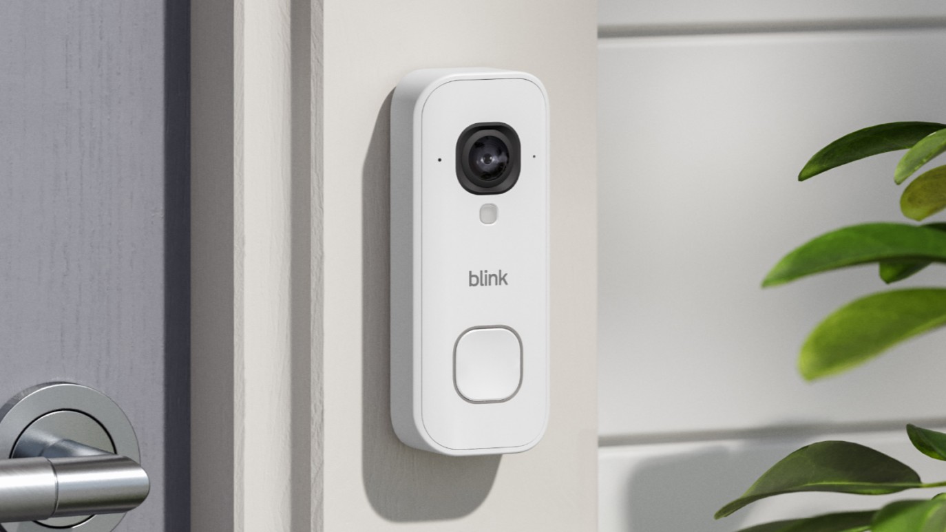 Blink Wired Video Doorbell 2K+ mounted on wall beside door